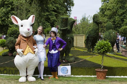 Alice Characters in front of Topiary